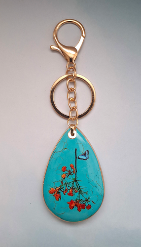 Orange Flowers with Butterfly on Turquoise Bag Charm