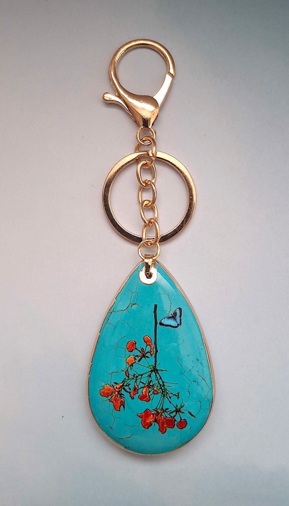 Orange Flowers with Butterfly on Turquoise Bag Charm