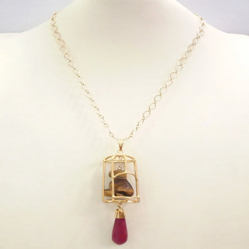 Carved Brown Tigers Eye Dog on Cage with Red Jade 