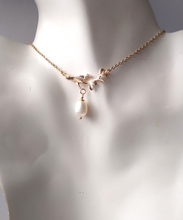 Mockingjay on a branch with White Pearl Collar Necklace
